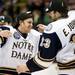 Notre Dame senior defenseman Sam Calabrese embrases sophomore Eric Johnson after beating Michigan on Sunday, March 24. Daniel Brenner I AnnArbor.com